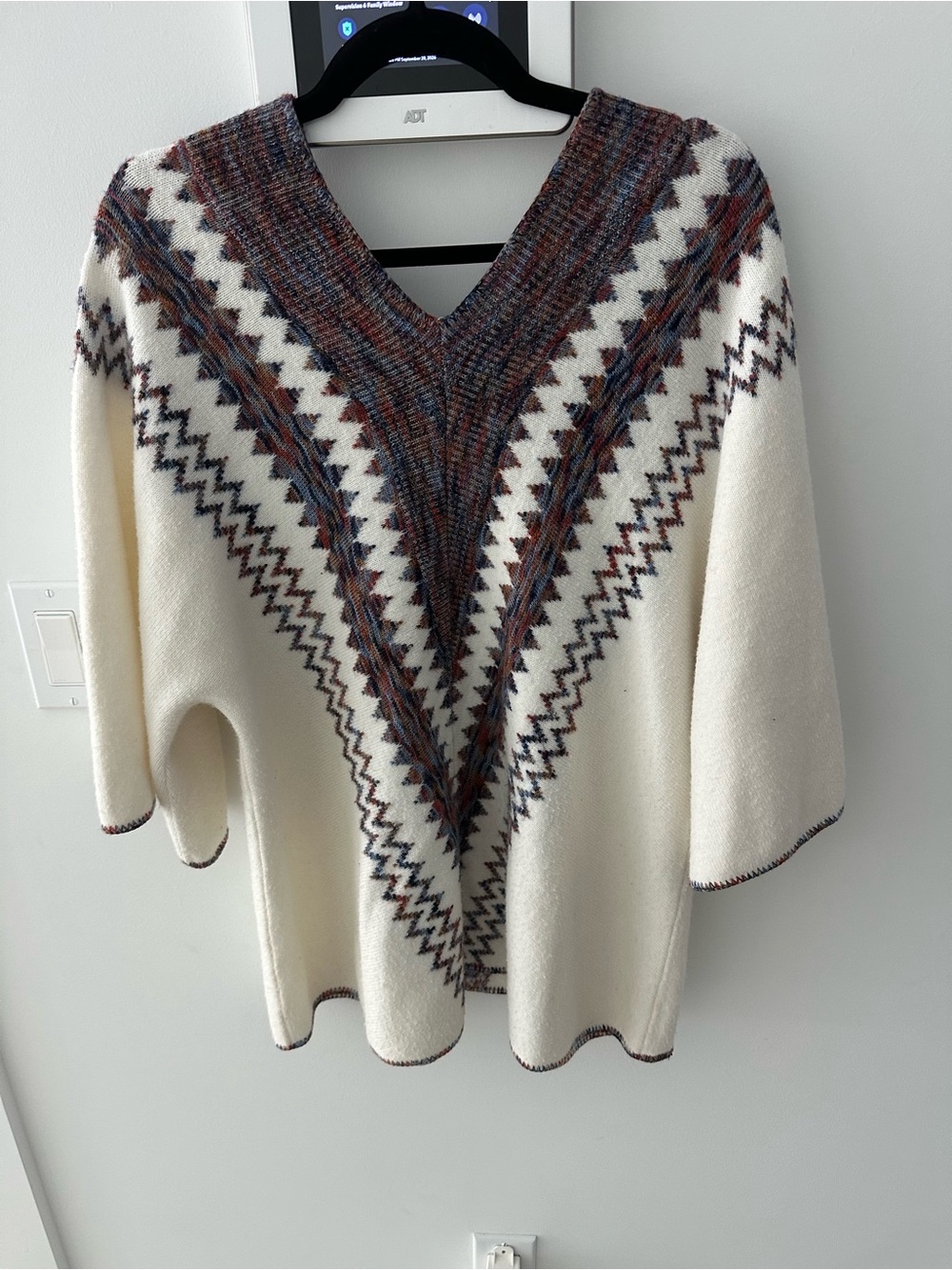 Ivory V‑Neck Patterned Poncho Sweater
